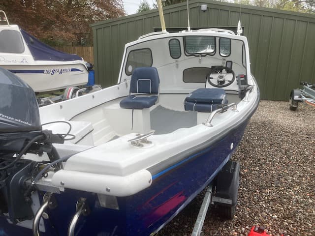 2021 Arran 16 with blue hull mint 15hp Yamaha SBS roller trailer.