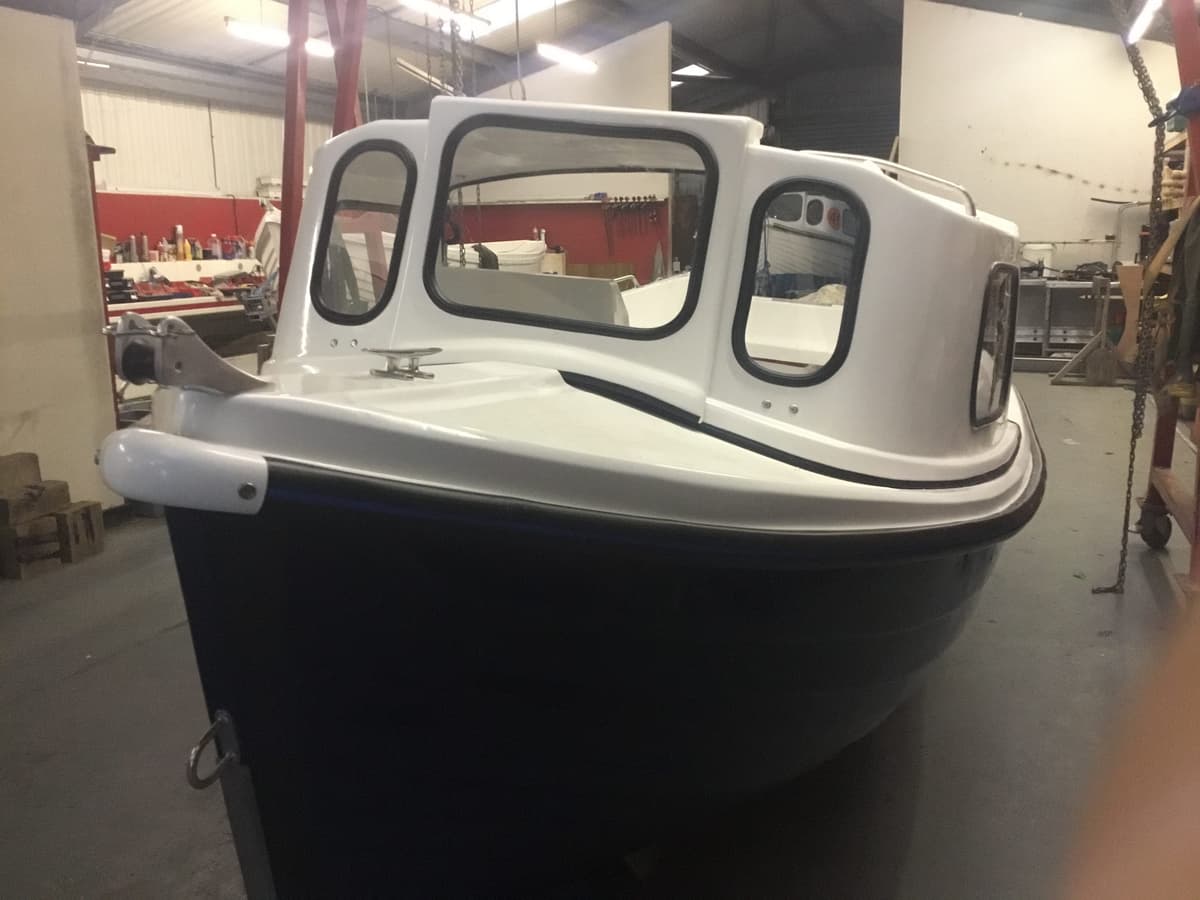 Arran 16 with blue hull cuddy cover grab rails bilge pump